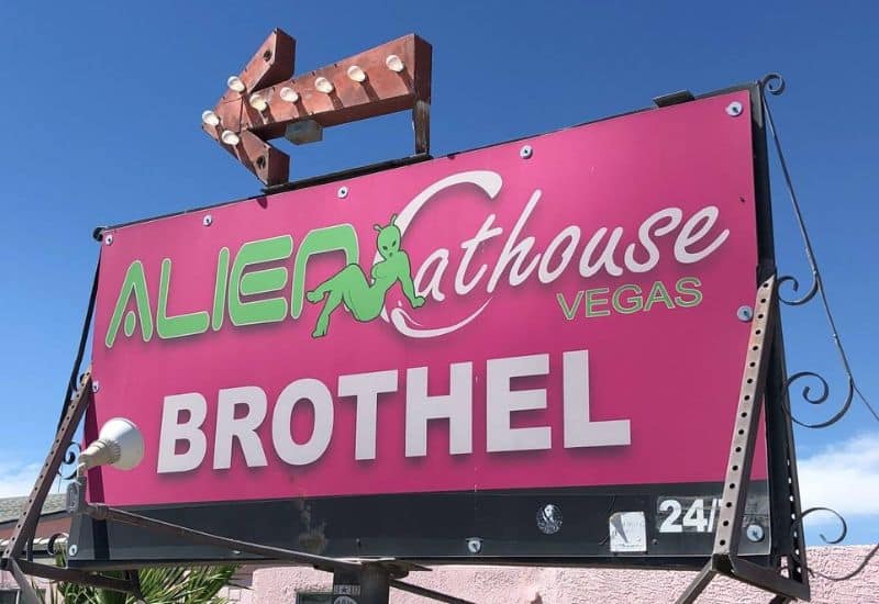 alien cathouse brothel sign