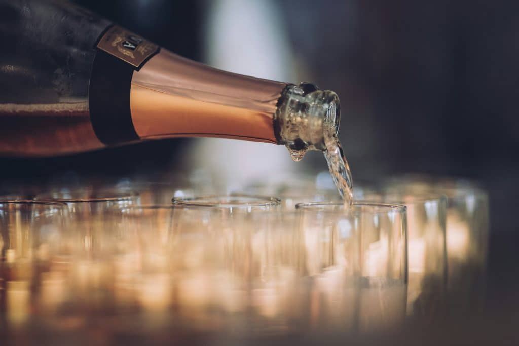 Champagne being poured in glasses